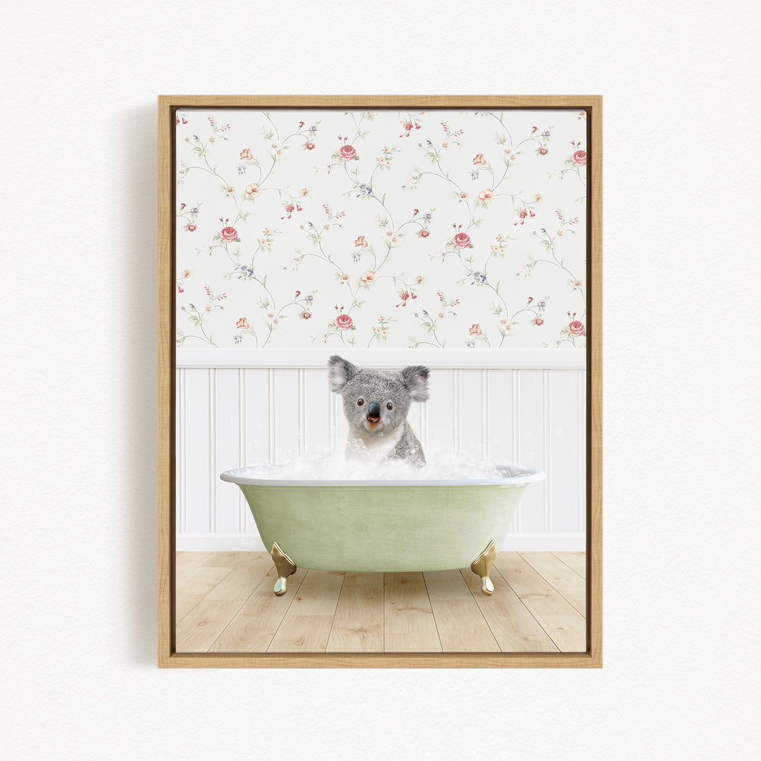 A koala bear sitting in a green bathtub filled with water, with a floral wallpaper in the background.
