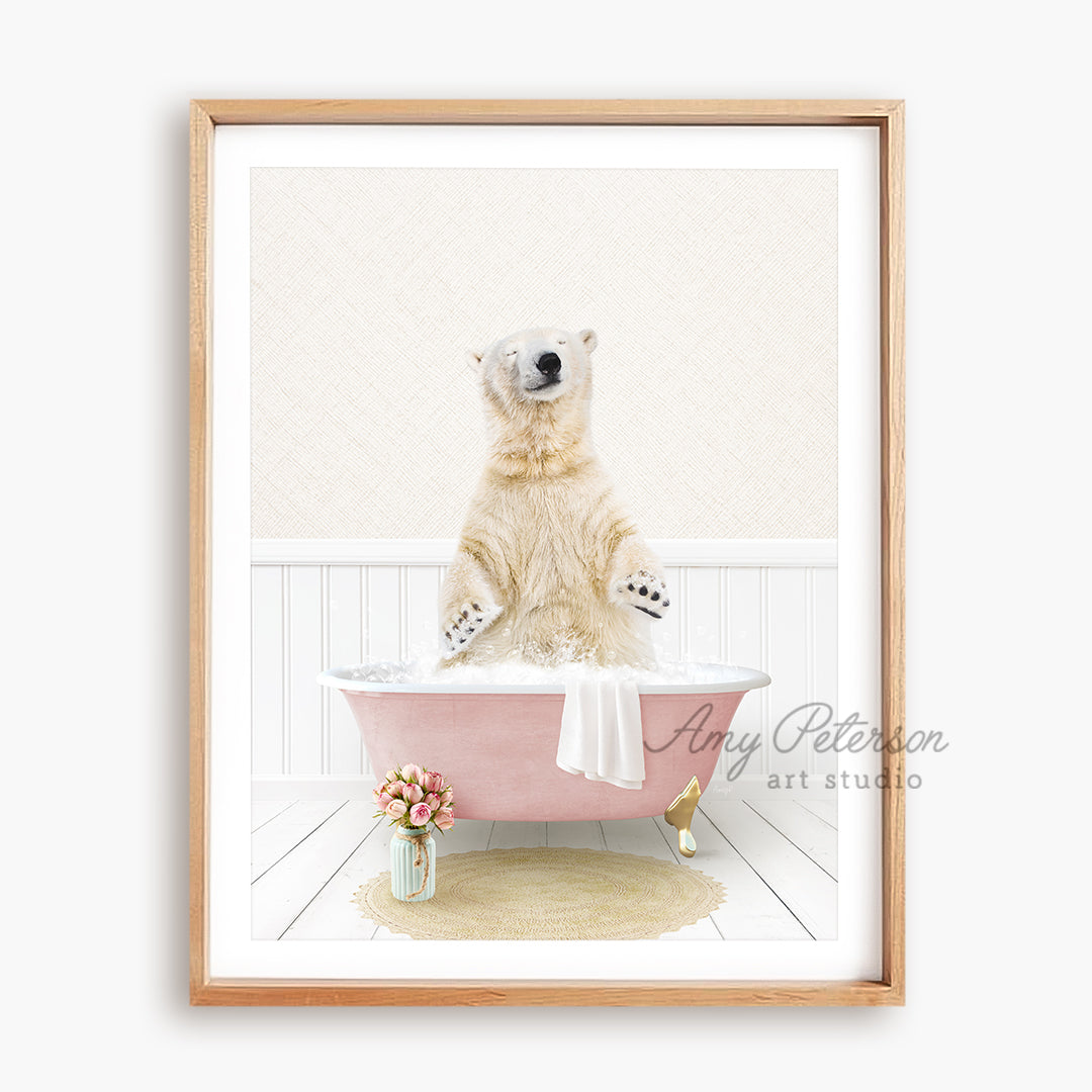 a polar bear sitting in a pink bath tub