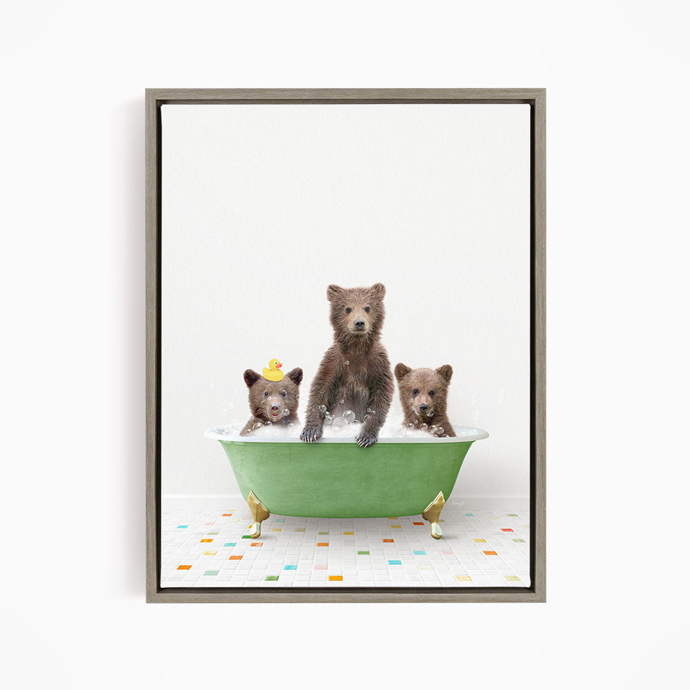 A framed image depicting three bears sitting in a green bathtub, with one bear sitting in the center and two bears sitting on either side.