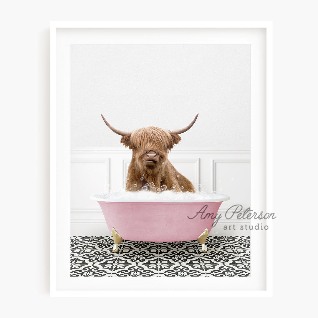 a brown dog sitting in a pink bath tub