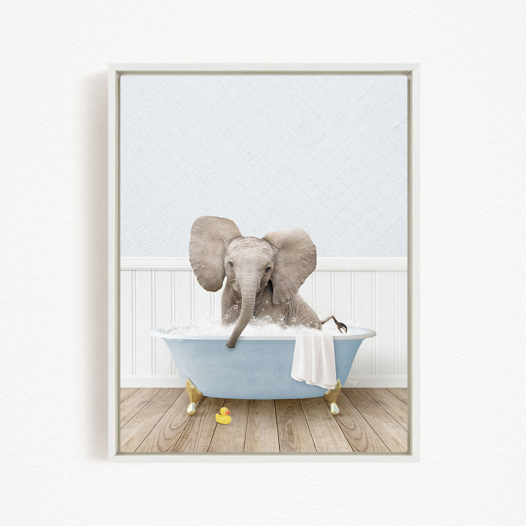 A gray elephant is sitting in a blue bathtub filled with water, surrounded by yellow rubber duckies.