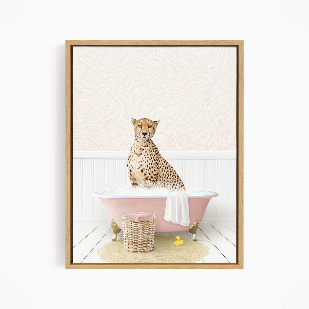 A cheetah sitting in a pink bathtub filled with bubbles, surrounded by rubber ducks.