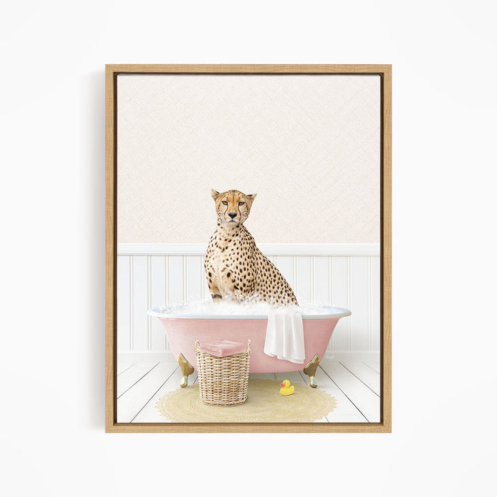 A cheetah sitting in a pink bathtub filled with bubbles, surrounded by rubber ducks.