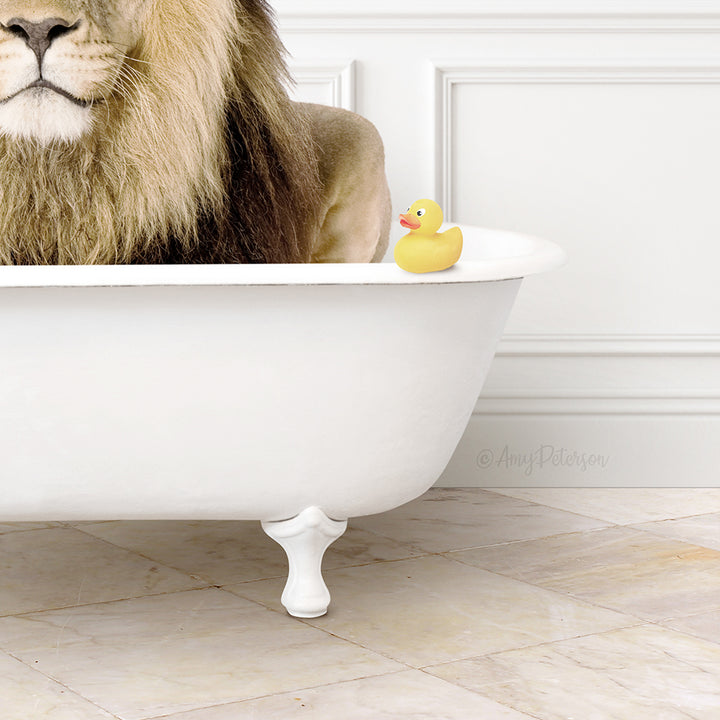 A white clawfoot bathtub filled with water, with a yellow rubber duck floating on the surface.
