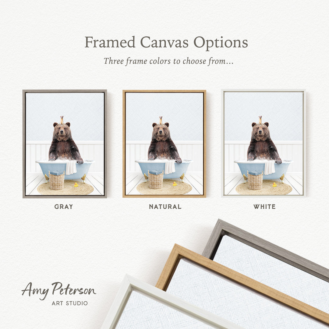 three framed canvas options featuring a bear sitting in a bathtub, each with a different frame color: gray, natural, and white.