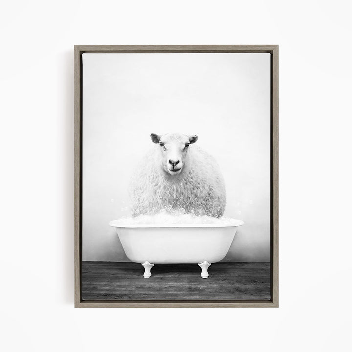 A fluffy white sheep sits in a white bathtub filled with bubbles, creating a whimsical and amusing scene.