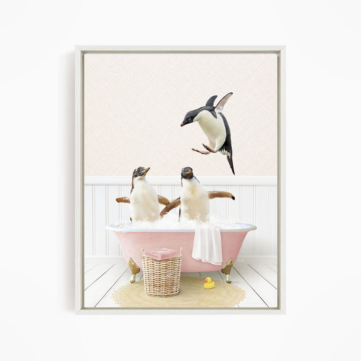 A pink bathtub filled with water, with two penguins sitting in it and one flying above them.