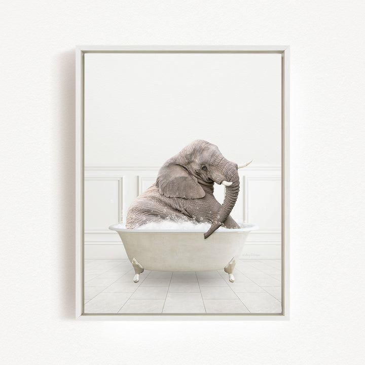 A gray elephant sitting in a white bathtub filled with water, creating a whimsical and playful scene.