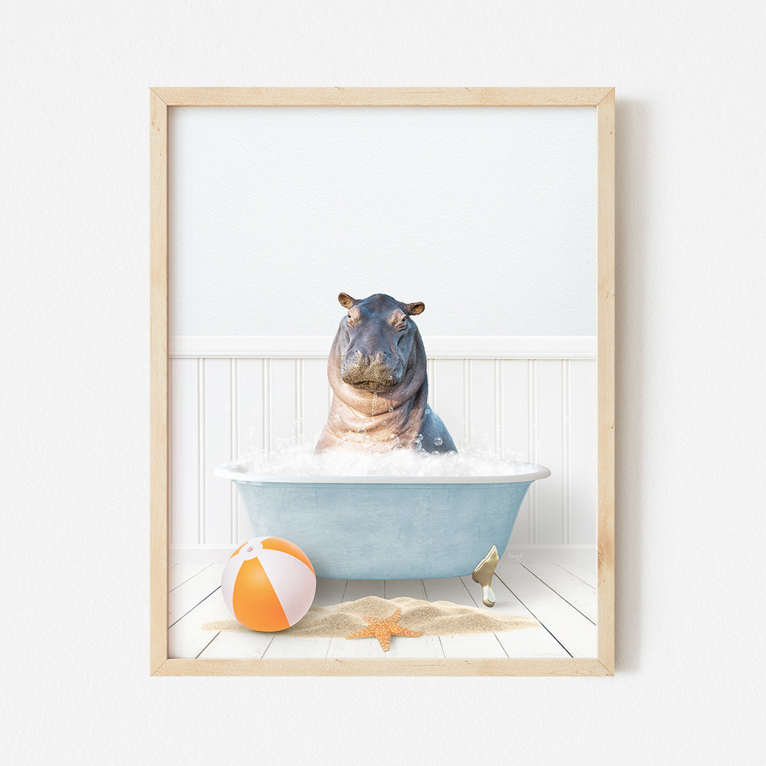 a hippo in a bathtub with a beach ball