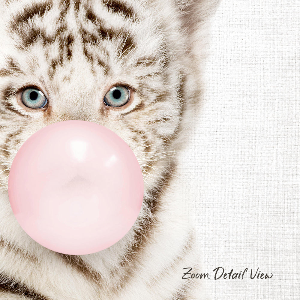 A close-up of a cat's face with its eyes open, looking directly at the camera, and blowing a pink bubble with a bubble gum bubble wand.