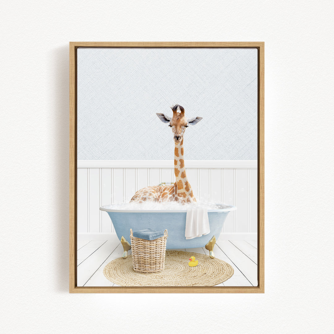 A giraffe sitting in a blue bathtub filled with bubbles, surrounded by a basket of toys and a yellow rubber duck.