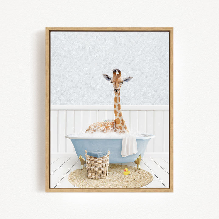 A giraffe sitting in a blue bathtub filled with bubbles, surrounded by a basket of toys and a yellow rubber duck.