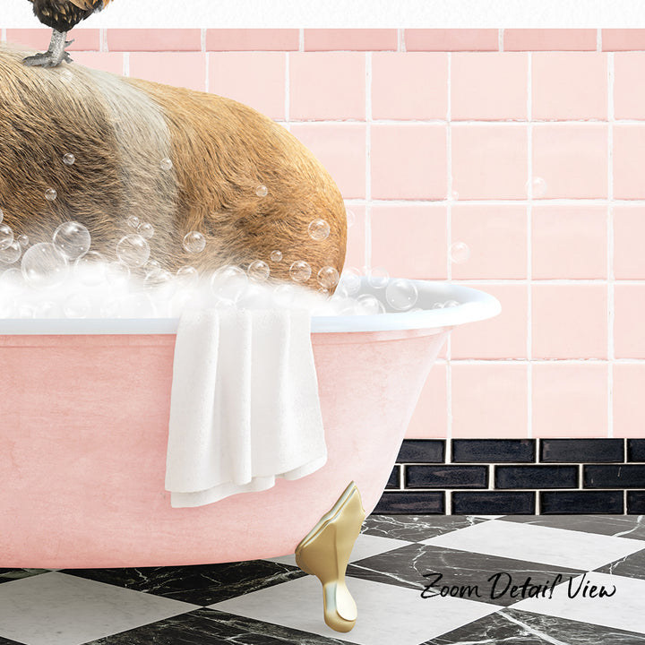 A dog is sitting in a pink bathtub filled with bubbles, with a towel draped over the side and a gold shoe visible at the bottom of the tub.