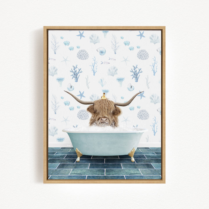 A brown cow with long horns is sitting in a white bathtub filled with bubbles, surrounded by a blue and white patterned wall.