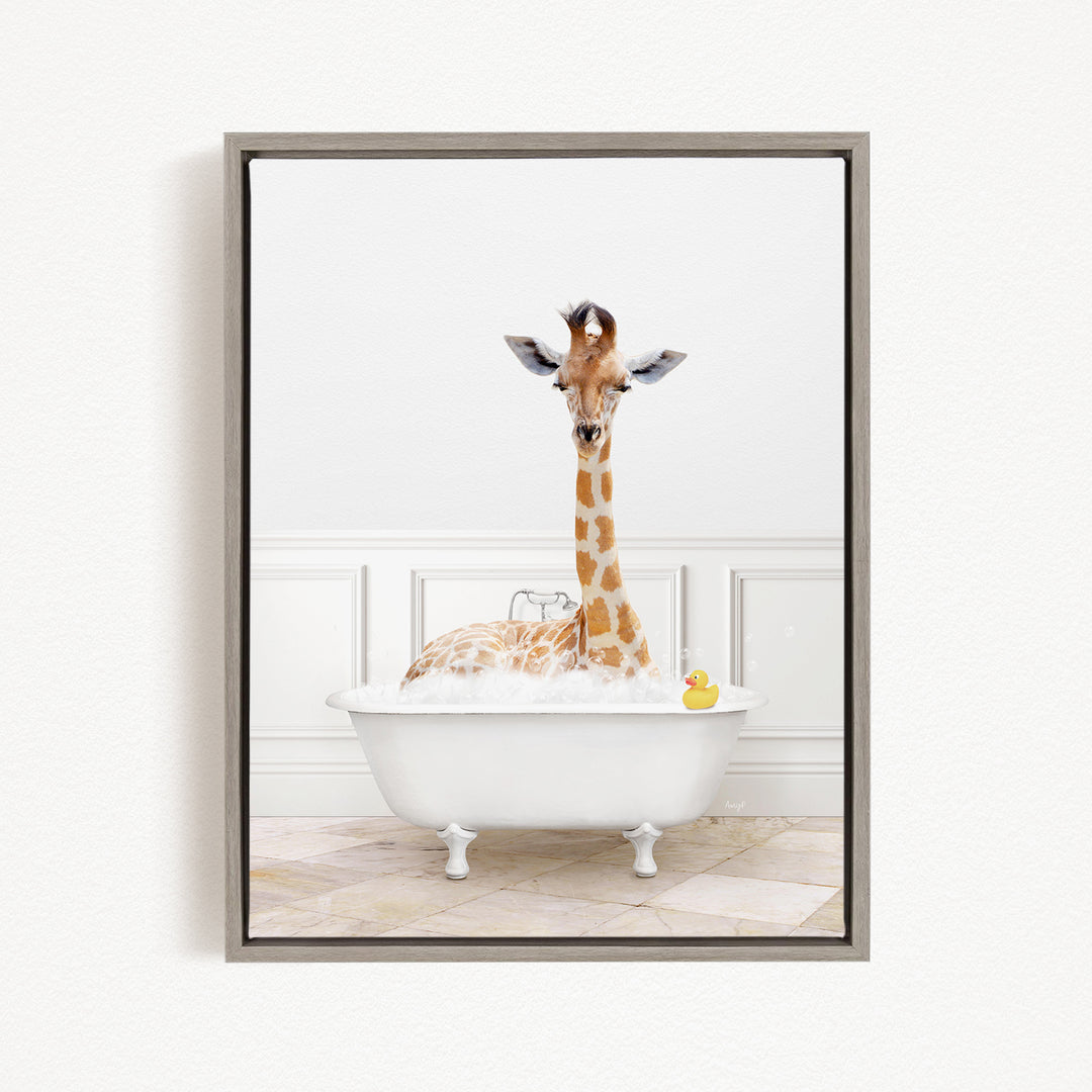 A giraffe sitting in a white bathtub filled with bubbles, with a rubber duck floating in the water.