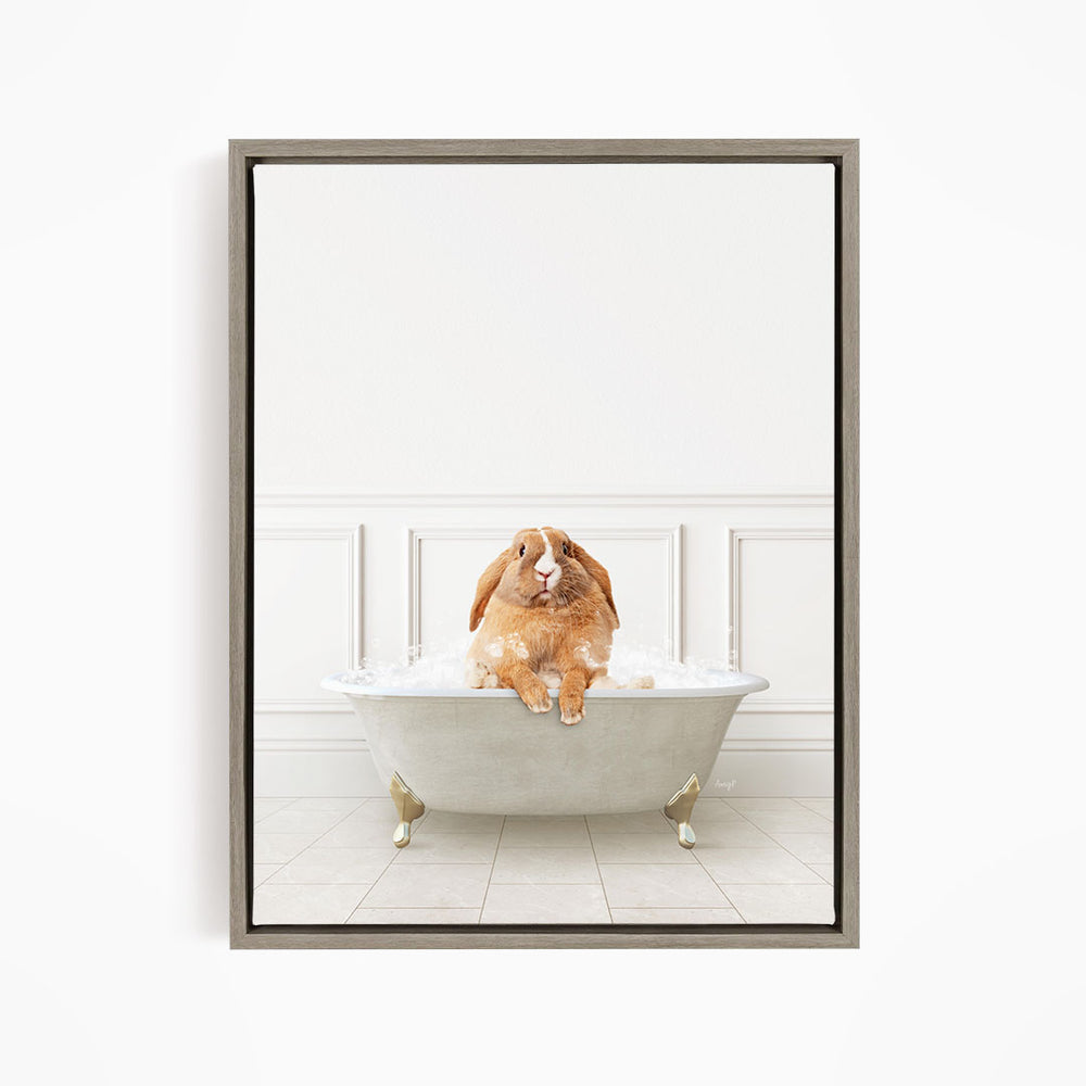 A brown rabbit sitting in a white bathtub filled with water, looking up at the camera.