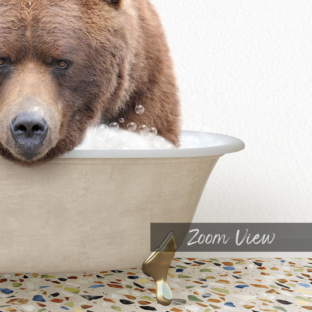 A close-up of a brown bear sitting in a bathtub filled with water and bubbles, with a text overlay that reads "Zoom View".