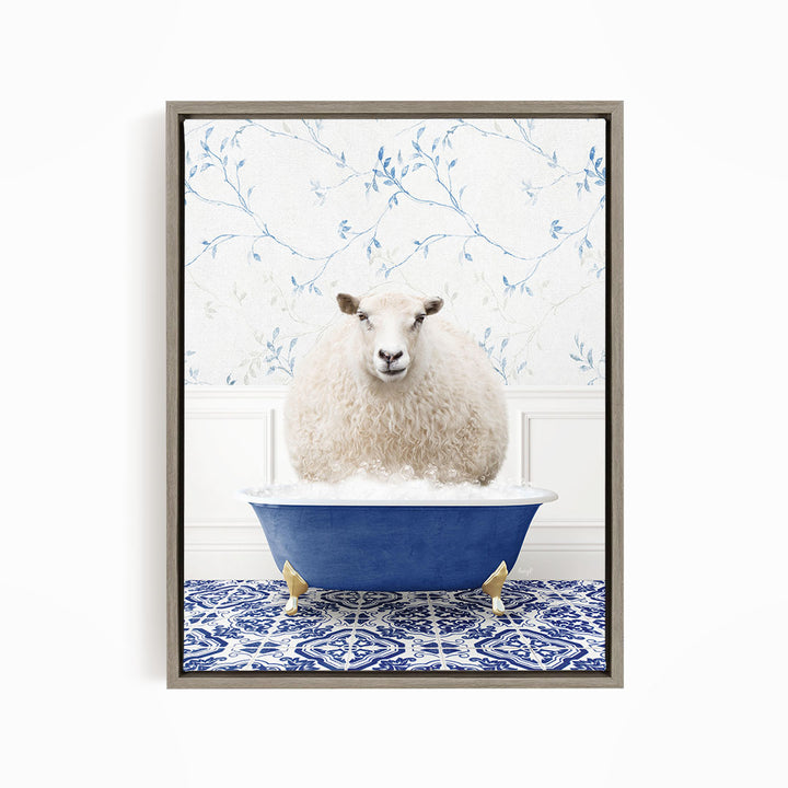 A fluffy white sheep sits in a blue bathtub, surrounded by a blue and white patterned floor.