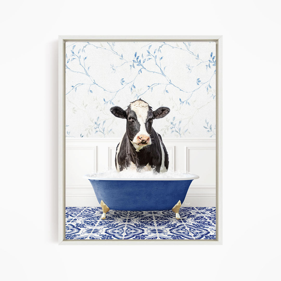 A black and white cow is standing in a blue bathtub filled with water, creating a whimsical and humorous scene.
