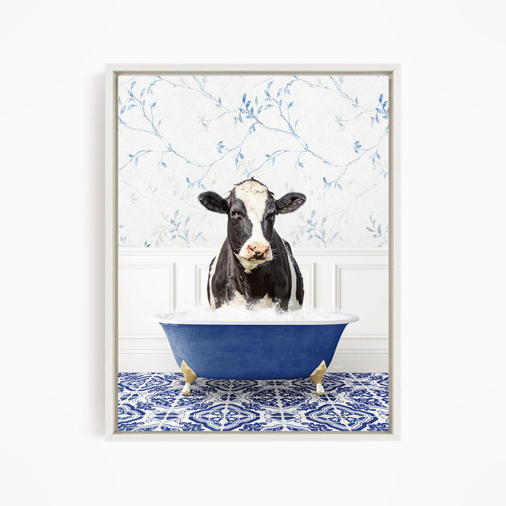 A black and white cow is standing in a blue bathtub filled with water, creating a whimsical and humorous scene.