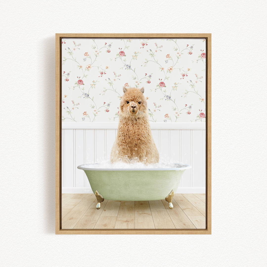 A fluffy brown alpaca sitting in a green bathtub filled with bubbles, with a floral wallpaper in the background.