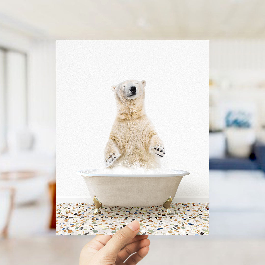 A polar bear standing in a bathtub filled with water, with its paws submerged in the water.