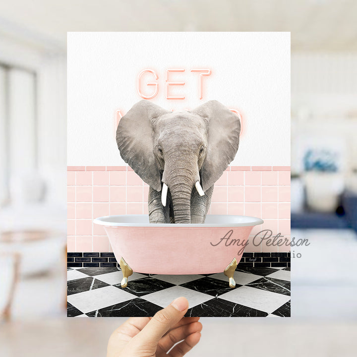 a person holding up a card with an elephant in a bathtub