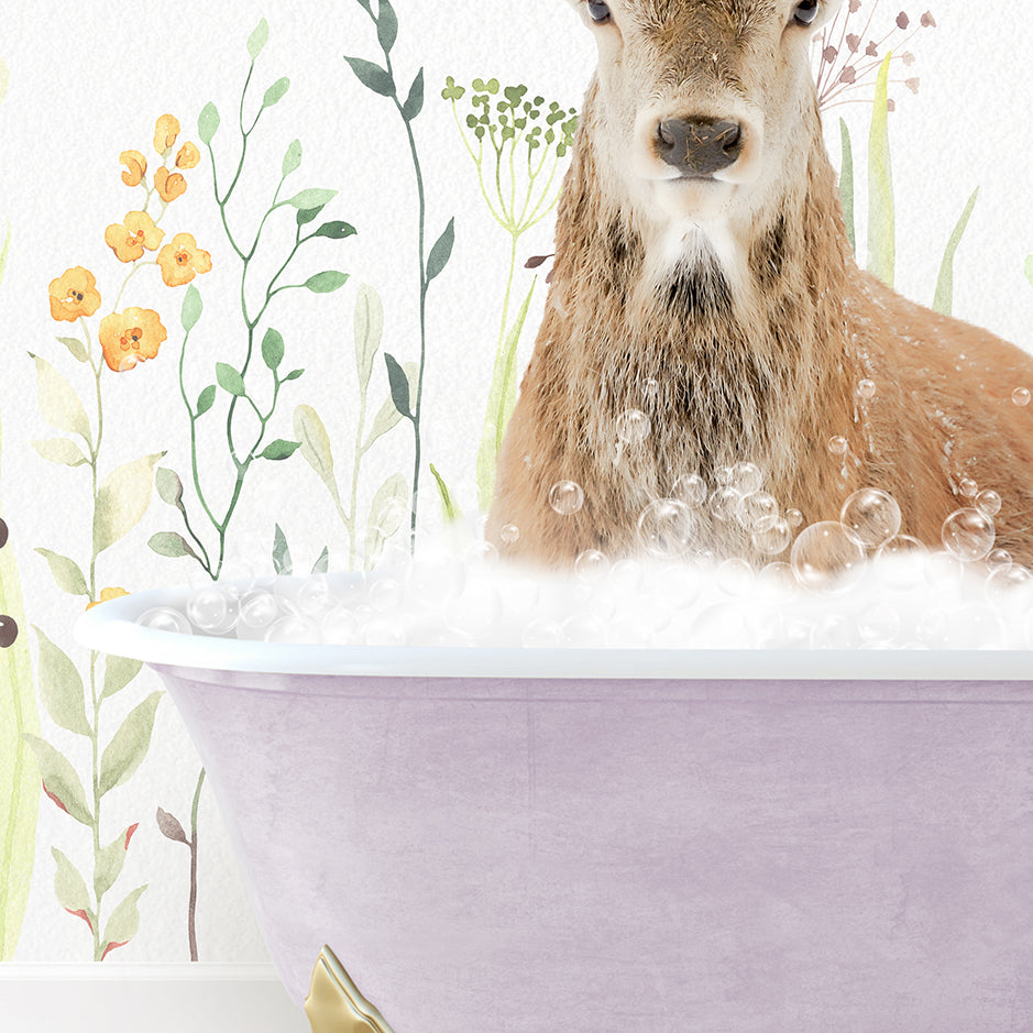 a deer is sitting in a bathtub full of bubbles