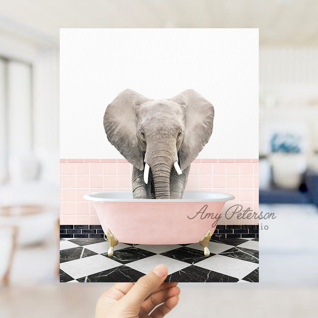 a person holding up a card with an elephant in a bathtub