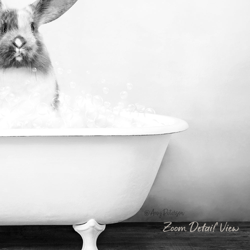 A rabbit sitting in a white bathtub filled with bubbles, creating a whimsical and playful scene.