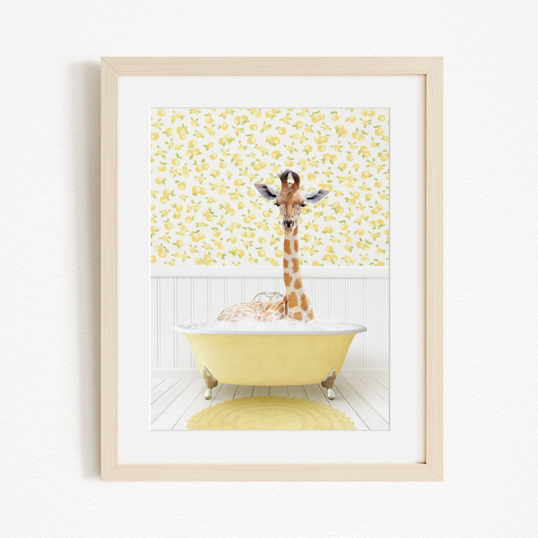 A giraffe is sitting in a yellow bathtub filled with bubbles, surrounded by a yellow floral wallpaper.