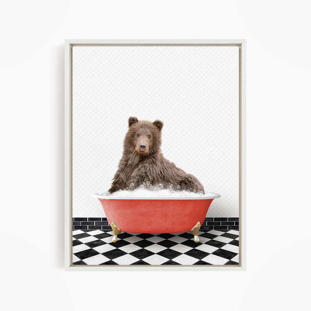 A brown bear sitting in a red bathtub filled with bubbles, with a black and white checkered floor in the background.