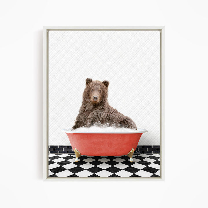 A brown bear sitting in a red bathtub filled with bubbles, with a black and white checkered floor in the background.