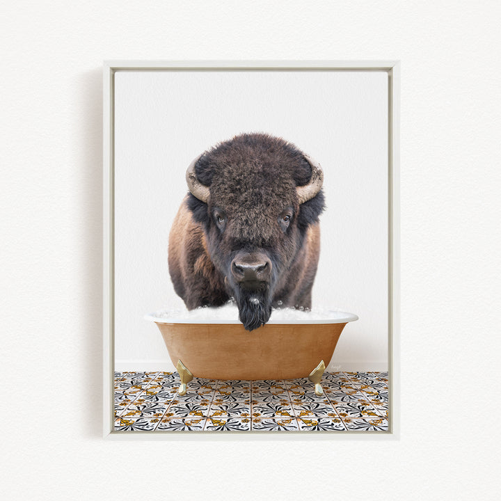 A buffalo with large horns is standing in a bathtub filled with water, creating a playful and whimsical scene.