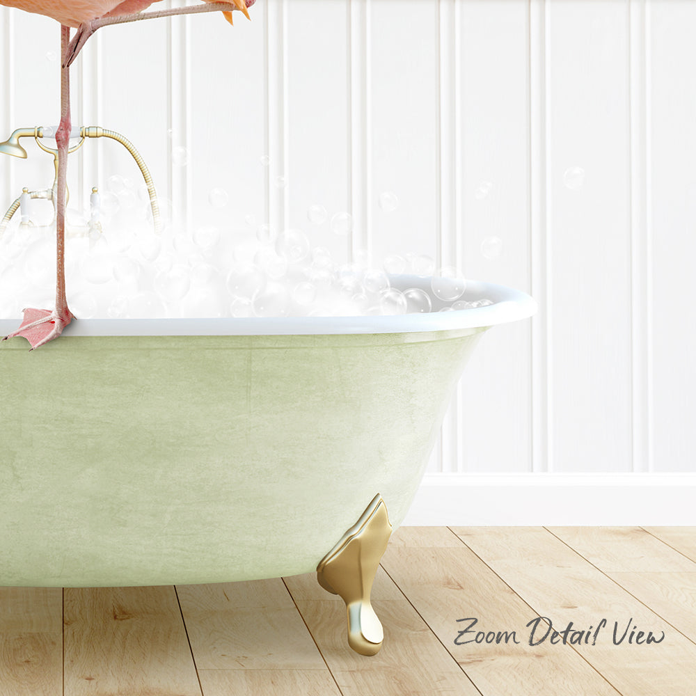 A green claw-foot bathtub filled with bubbles, with a pink flamingo perched on the edge.