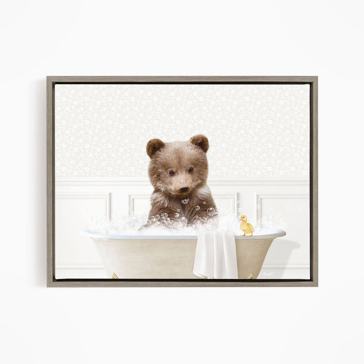 A brown bear sitting in a bathtub filled with bubbles, with a yellow duck nearby.