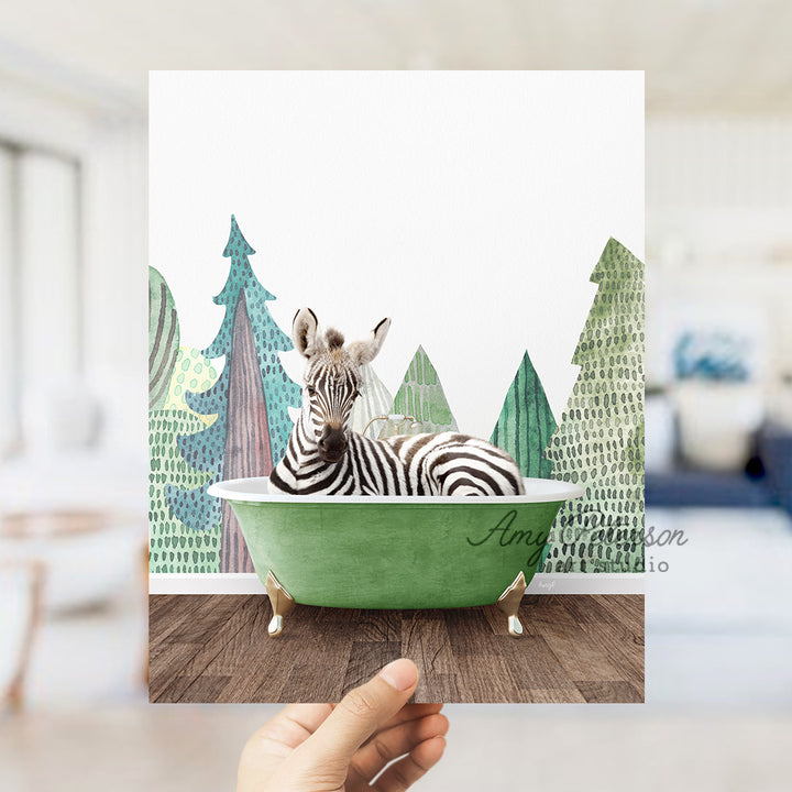 a hand holding up a card with a zebra in a bathtub