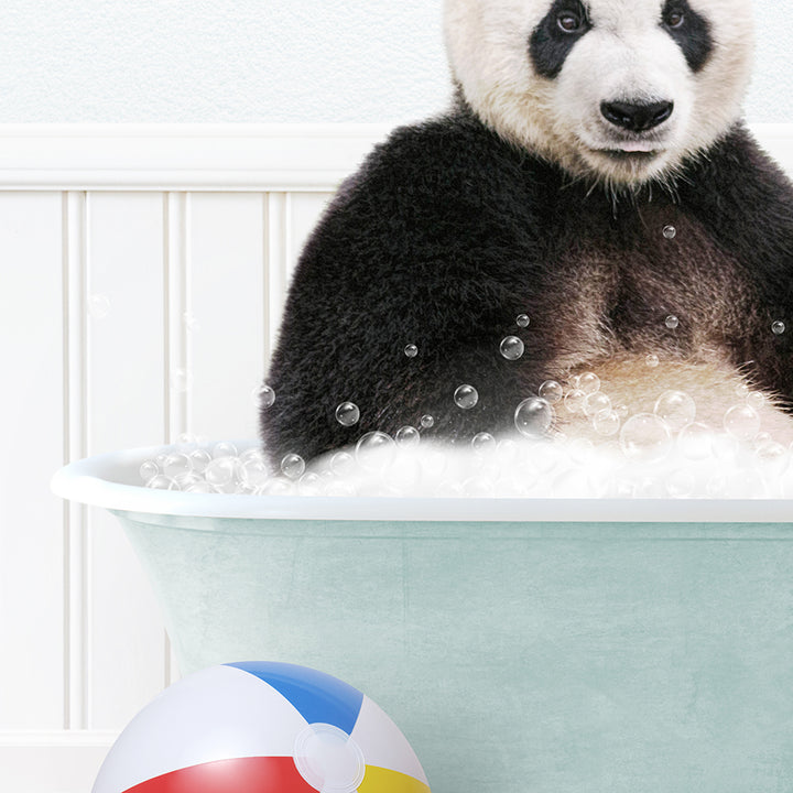 a panda bear sitting in a bathtub with bubbles