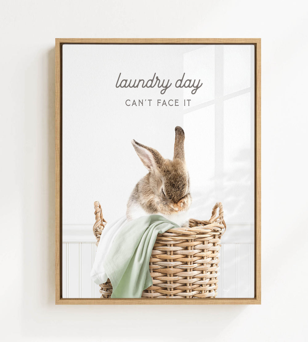 A cute rabbit sitting in a wicker basket, with the text "laundry day can't face it" written above the image.