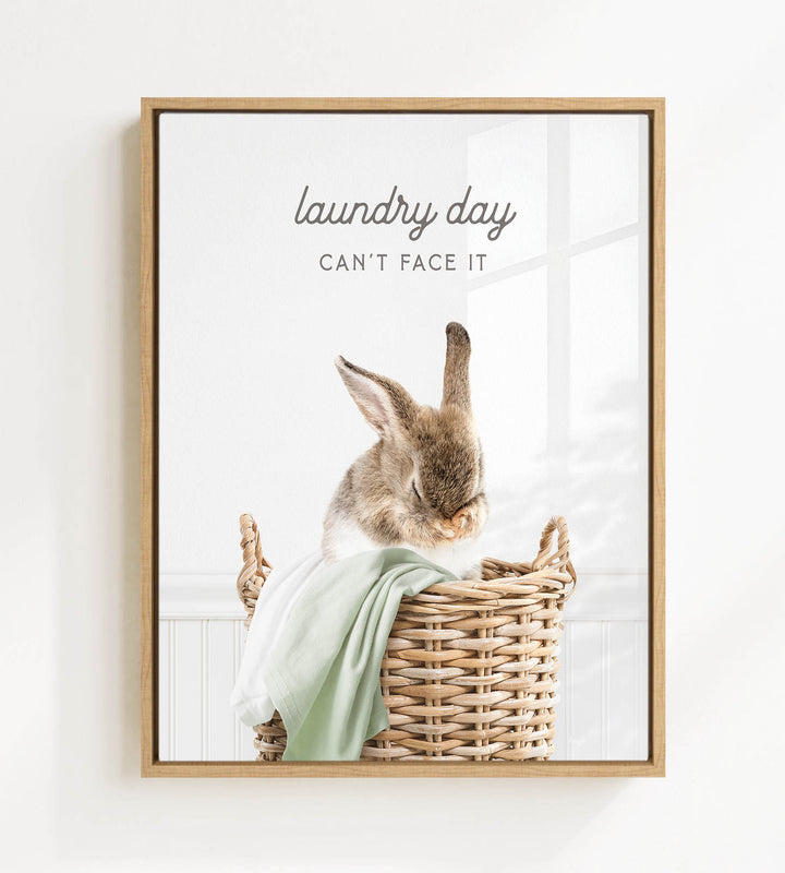 A cute rabbit sitting in a wicker basket, with the text "laundry day can't face it" written above the image.