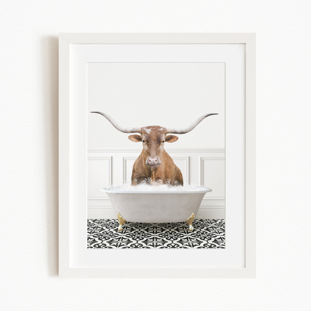 A brown cow with large horns is sitting in a white bathtub filled with water, creating a whimsical and humorous scene.