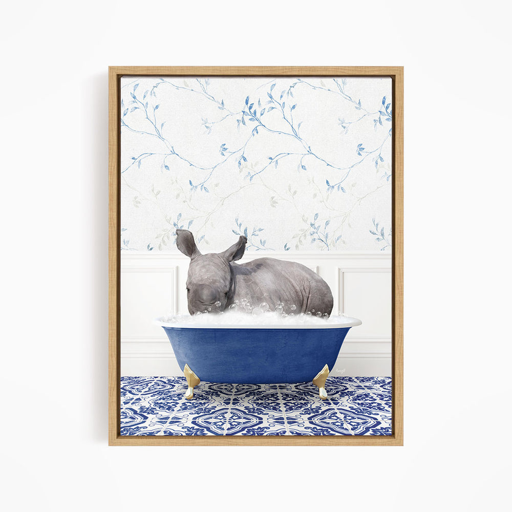A rhinoceros is sitting in a blue bathtub filled with water, surrounded by a blue and white patterned floor.