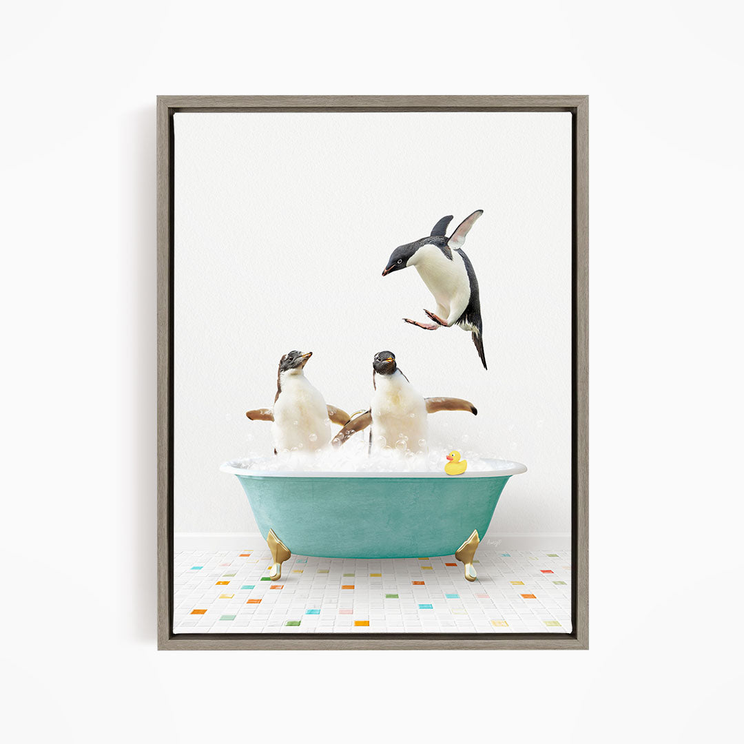 A framed image depicting two penguins sitting in a bathtub filled with bubbles, with one penguin flying towards the other.