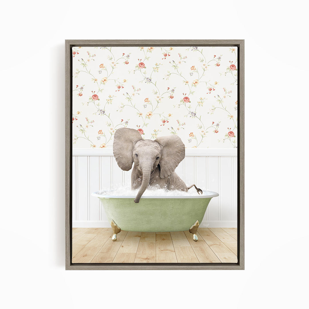 A gray elephant is sitting in a green bathtub, surrounded by a floral wallpaper.