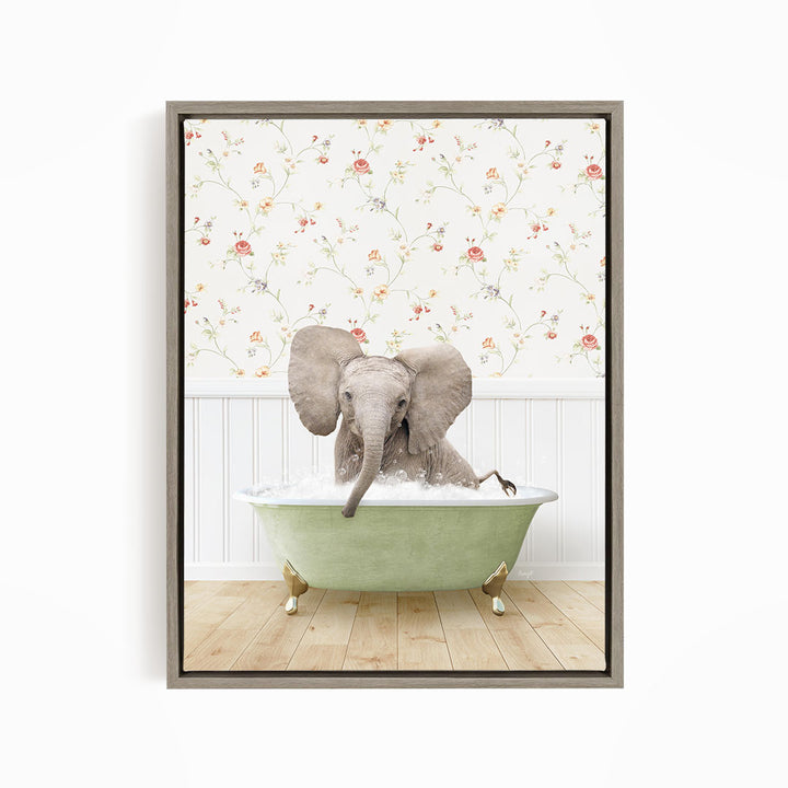 A gray elephant is sitting in a green bathtub, surrounded by a floral wallpaper.