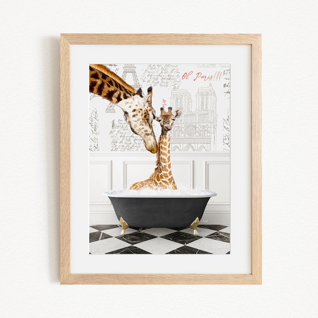 A framed image depicting two giraffes in a bathtub, with one giraffe partially submerged in the water and the other standing above it.