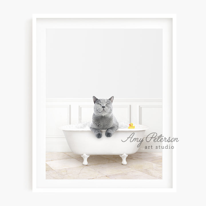 a cat sitting in a bathtub with a rubber duck in it