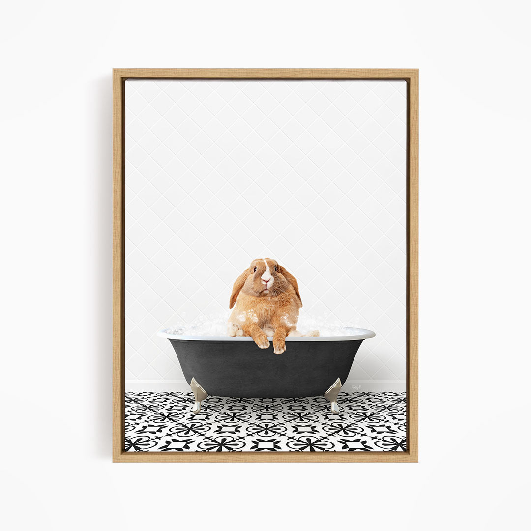 A brown rabbit sitting in a black bathtub filled with water, surrounded by a black and white patterned floor.