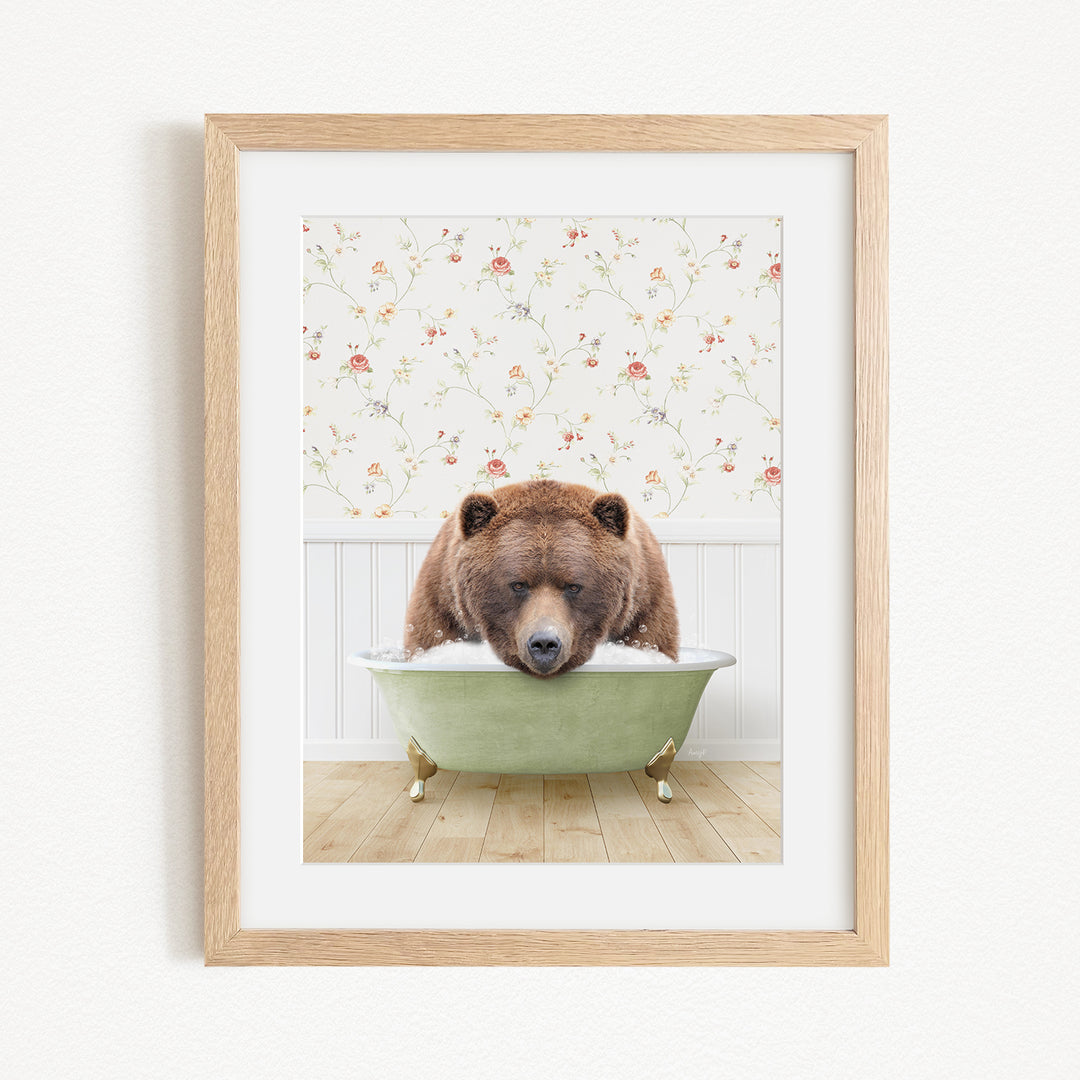 A brown bear is sitting in a green bathtub, surrounded by a floral patterned wall.