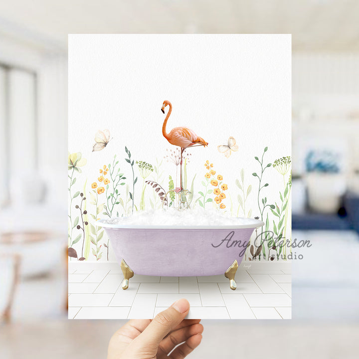 a person holding a card with a flamingo in a bathtub